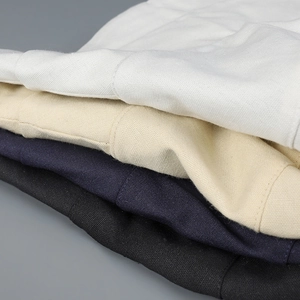 Close-up of twill fabric textures showing stitching details on folded outdoor hats