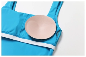 Detail of blue tennis dress featuring removable padded cups and breathable mesh lining