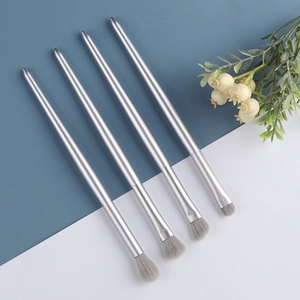 Minimalist 4-piece eyeshadow brush set with silver handles and soft grey fiber bristles
