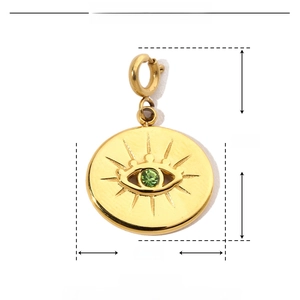 Detailed size specifications of a gold evil eye pendant with green rhinestones