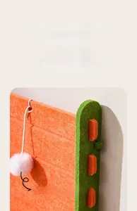Detail of L-shaped felt cat scratcher with mortise structure and plush toy ball