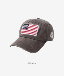 Detail view of washed cotton baseball cap featuring vintage USA flag embroidery on side