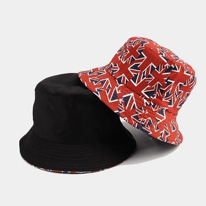 Detail showing two-sided bucket hats in black cotton and Union Jack flag pattern