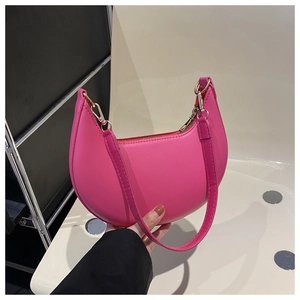 Detail view of the elegant crescent bag in rose pink with high-quality metal zipper