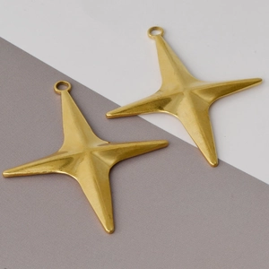 Close-up of two 18k gold plated 304 stainless steel cross star pendants for DIY jewelry