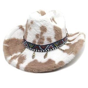 Western plush cow print cowboy hat with ethnic braided band and metal heart charms