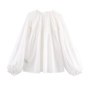 White long-sleeve cotton blouse with pleated collar details and stylish puff sleeves