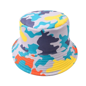 Detail of colorful camouflage bucket hat with yellow, blue, and purple patchwork patterns