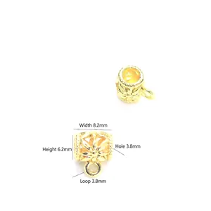 18K gold-plated hollow floral spacer bead with loop and dimensions 8.2mm by 6.2mm