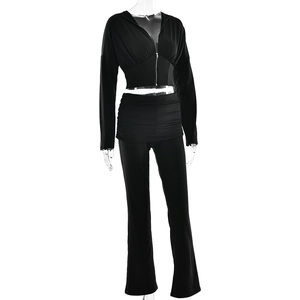 Detail view of black long sleeve zip hoodie and high waist ruched flared trousers set