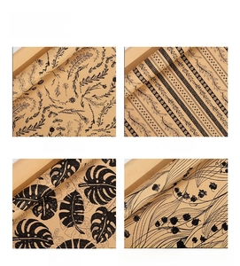 Detailed four-pattern grid of vintage kraft gift wrap with black hand-drawn floral prints