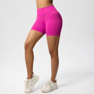 Detail of high-waisted seamless hot pink fitness shorts with tummy control waistband
