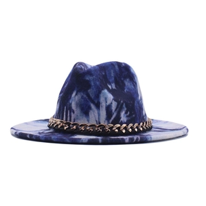 Detail of blue and white tie-dye wool jazz hat featuring a gold chain band decoration