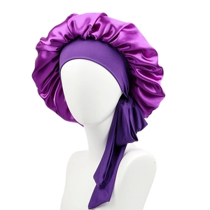 Detail view of purple satin bonnet with elastic headband on mannequin head