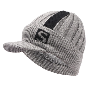 Detailed side view of grey knit beanie with visor, black S logo and warm fleece lining