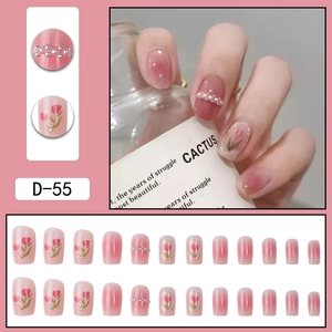 Pink gradient press-on nails set featuring tulip floral art and pearl accents