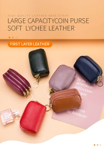 Macro shot of colorful lychee grain genuine leather coin purses with dual zippers and keyrings