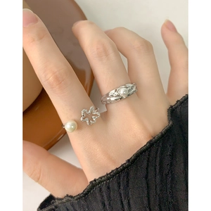 S925 sterling silver rings featuring hollow flower design and elegant bread pearl accents