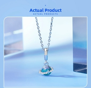 Detailed close-up of s925 silver planet pendant with blue-purple gradient and crystals