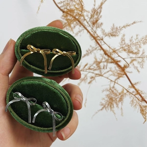 Girl style bow ribbon stud earrings in gold and silver set in green velvet jewelry box