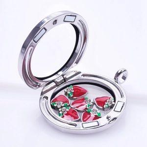 Silver floating charm locket with red strawberry pendants and sparkling crystals