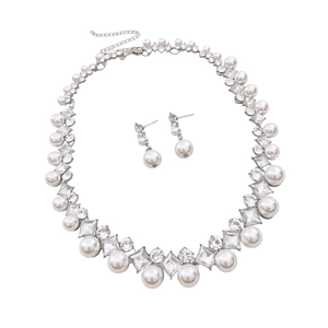 Vintage French pearl jewelry set with diamond-studded necklace and matching drop earrings