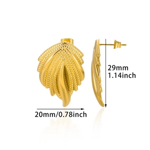 Detail view of golden wing earrings showing textured patterns and size measurements