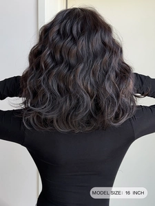Rear view of 16-inch dark wavy synthetic wig showing realistic hair texture and curls