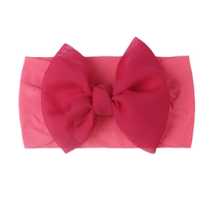 Detailed view of rose pink double-layered mesh bow headband for babies and toddlers
