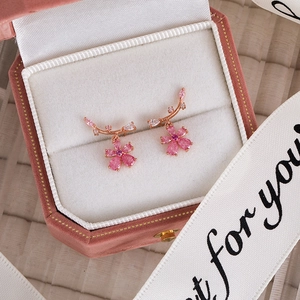 Detailed view of pink zircon flower earrings in a premium velvet jewelry gift box
