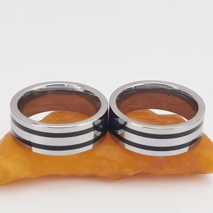Minimalist titanium steel ring for men and women featuring black enamel inlay and silver finish