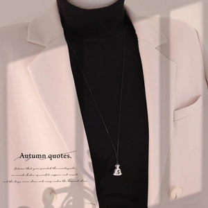 Silver money bag pendant necklace with dollar symbol on a black cord for women