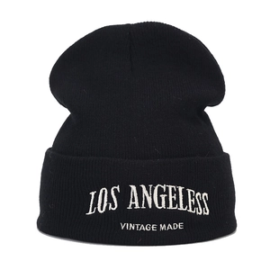 Classic black knitted beanie hat with Los Angeles vintage embroidery in minimalist style