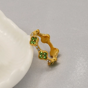 Luxurious 18K gold plated titanium clover ring with green and white cubic zirconia crystals