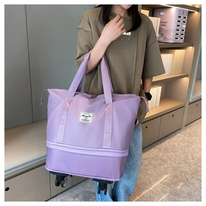 Detail of expandable purple travel bag with smooth rolling wheels and durable handles