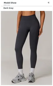 Detailed close-up of dark grey high-waisted seamless yoga pants on a model
