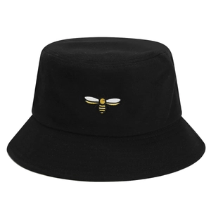 Unisex black cotton bucket hat featuring detailed yellow bee embroidery on center