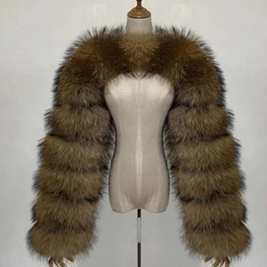 Detailed view of fluffy tan gradient faux fox fur shawl wrap with oversized sleeves