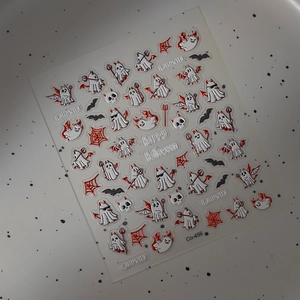Macro view of 5D Halloween nail stickers with ghost, bat, and embossed texture