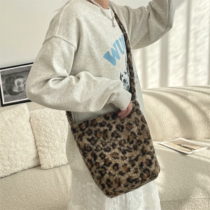 Fashionable leopard print plush shoulder bag shown being worn for autumn and winter style