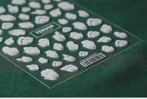 Macro shot of 5D embossed nail sticker TS-086 with 3D white relief hill pattern textures