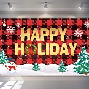 Macro detail of red and black buffalo plaid Christmas banner with gold Happy Holiday text
