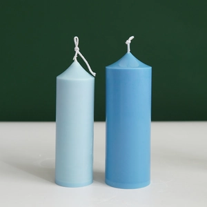 Tall spire cylindrical church candles in light and dark blue with cotton wicks