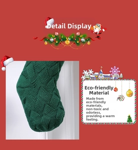 Detail of green knitted Christmas stocking showing eco-friendly non-toxic fabric texture