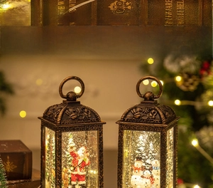 Detail of vintage Christmas lanterns featuring Santa, reindeer and embossed bronze patterns