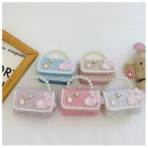 Detail of five-color sequin handbags with pearl handles and lace trim for girls