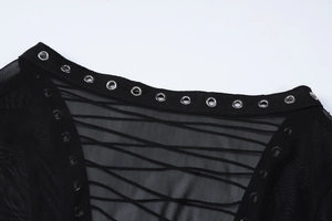 Detail of sheer black mesh neckline featuring silver metal eyelets and crisscross lacing