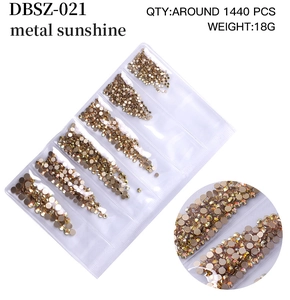 Macro detail of metal sunshine flatback nail art crystals with high-gloss reflection