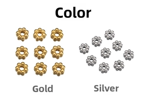 Macro shot of 18k gold and steel plated snowflake flower spacer beads for DIY jewelry