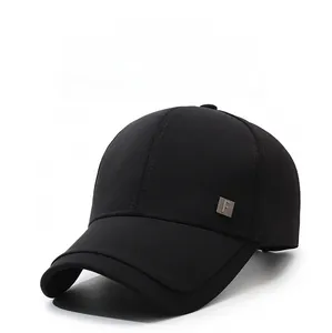 Close-up of black cotton baseball cap with a square metal F logo on the side